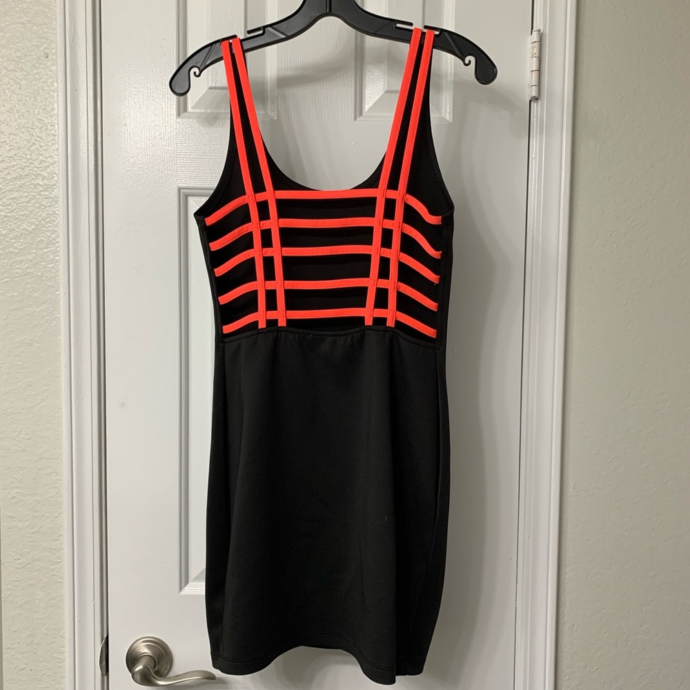 Black cage-back dress, glows under black light